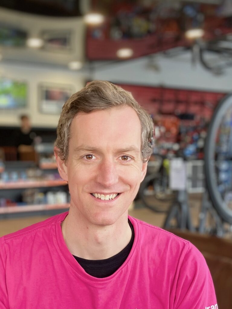 Picture of adult male in pink T-shirt